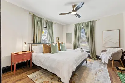 a bedroom with a bed and a ceiling fan at 2 Hot Tubs/Private Bar/ Pickleball & Basketball Ct in Georgetown