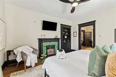 a bedroom with a bed and a fireplace at 2 Hot Tubs/Private Bar/ Pickleball & Basketball Ct in Georgetown