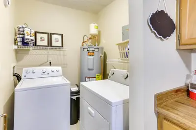 a kitchen with a refrigerator and a washer and dryer at Great for Travel Nurses! Home 4 Mi to Dtwn Troy in Troy