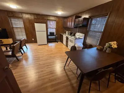 a kitchen and dining room with a table and chairs at Prime 1BR- Minutes to Toledo, Sylvania and MI in Toledo