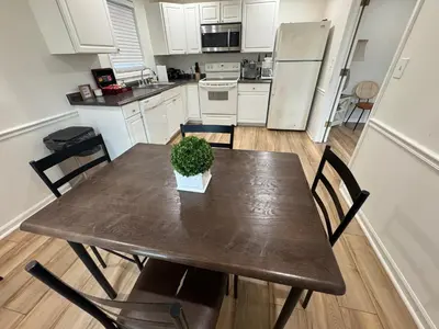 a kitchen with a table with a potted plant on it at Spacious 2BR Apartment near Toledo, Sylvania & MI in Toledo