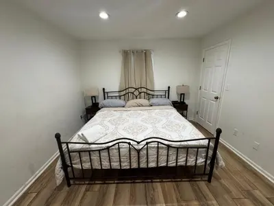 a bedroom with a large bed in a room at Spacious 2BR Apartment near Toledo, Sylvania & MI in Toledo