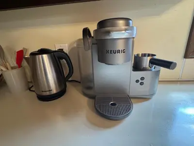 a kitchen counter with a mixer and a coffee maker at Modern 2BR Suite 202- Toledo & Sylvania Gateway in Toledo