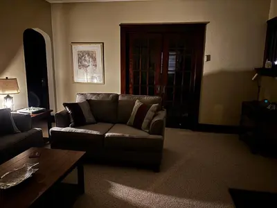 a living room with a couch and a coffee table at The Inn on Holgate Avenue in Defiance