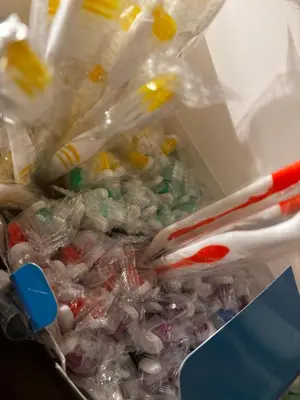 a box full of plastic tooth brushes and toothpaste at The Inn on Holgate Avenue in Defiance
