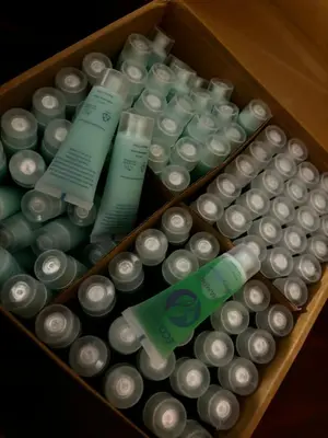 a box filled with lots of green and white bottles at The Inn on Holgate Avenue in Defiance