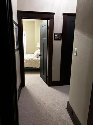 a hallway with a door leading to a bedroom at The Inn on Holgate Avenue in Defiance