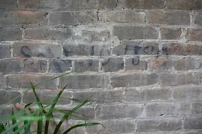 a brick wall with the word hope written on it at The Historic Berry Loft at Waterfront Hall in Wheeling