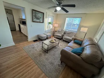 a living room with a couch and a table at Sunset Cornfield Oasis in Whiteford Center