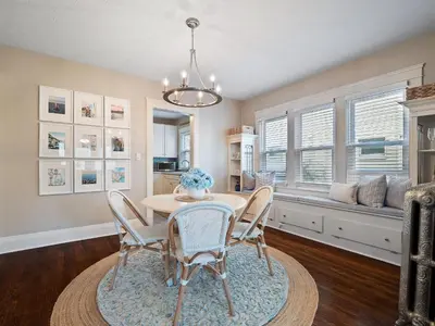 a dining room with a table and chairs at Stylish Lakeside Living - walk to the beach in Cleveland