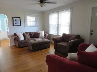 a living room with couches and a couch and a table at Minutes from Downtown Shopping and Dining Close to Cedar Point in Vermilion