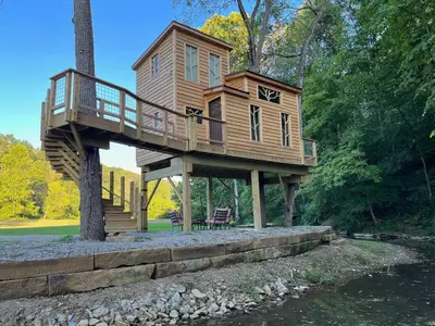 a tree house sitting on top of a tree at The Royal Roost Treehouse