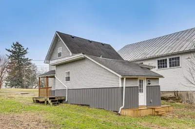 a large white house with a gambrel roof at Pets Welcome! Quiet Economy Home with Spacious Yard in Economy