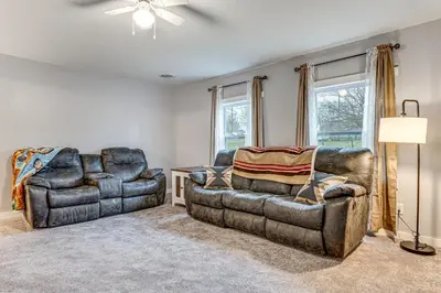 a living room with two chairs and a couch at Pets Welcome! Quiet Economy Home with Spacious Yard in Economy