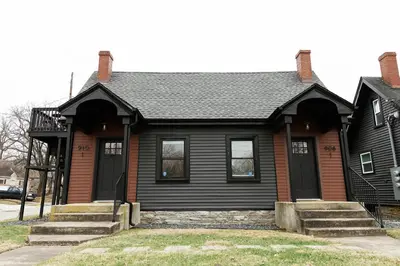 a black house with a black roof at Big Blue - Stylish Studio in Downtown Lexington in Lexington