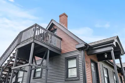 a house with a deck on top of it at Bourbon Trail - Loft in Downtown Lexington in Lexington