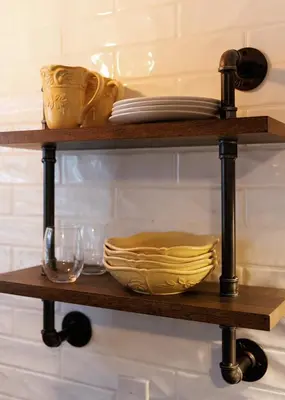 a shelf with plates and other items on it at Green Oasis - Studio in Downtown Lexington in Lexington