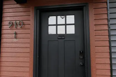 a black door with a window on a house at Green Oasis - Studio in Downtown Lexington in Lexington