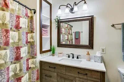 a bathroom with a sink and a mirror at 6 Mi to Dtwn Cincinnati Dog-Friendly Apt with Yard in Cincinnati