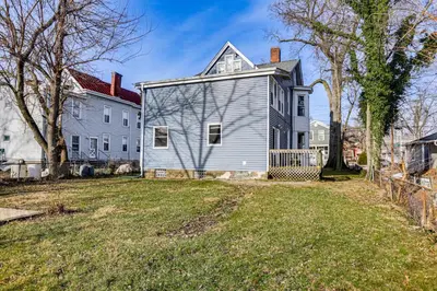a white house and a white house at 6 Mi to Dtwn Cincinnati Dog-Friendly Apt with Yard in Cincinnati