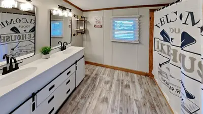 a bathroom with two sinks and a mirror at Put-in-Bay Island Club #65 in Put-in-Bay