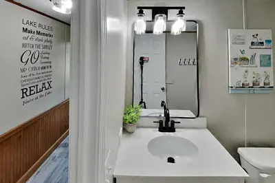 a bathroom with a sink and a mirror at Put-in-Bay Island Club #65 in Put-in-Bay