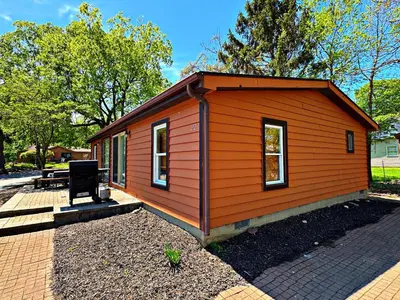 a small cabin with an orange roof on a patio at Put-in-Bay Island Club #22 in Put-in-Bay