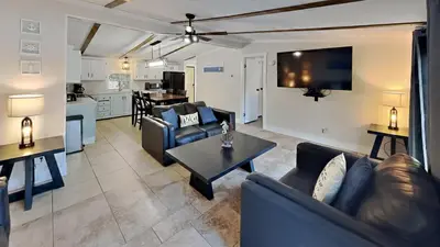 a living room with couches and a table and a kitchen at Put-in-Bay Island Club #22 in Put-in-Bay