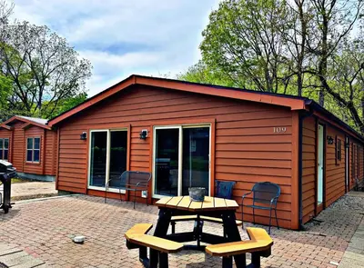 a small cabin with a picnic table in front of it at Put-in-Bay Island Club #109 in Put-in-Bay