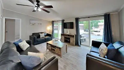 a living room with couches and a ceiling fan at Put-in-Bay Island Club #106 in Put-in-Bay