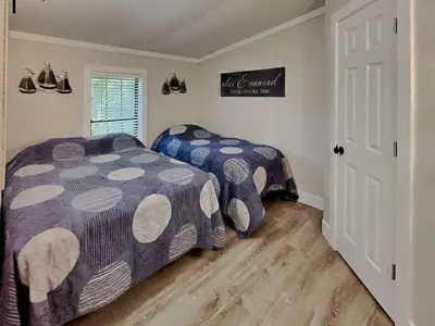 a bedroom with two beds and a window at Put-in-Bay Island Club #68 in Put-in-Bay