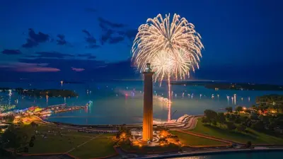 a firework display in a park with the water in the background at Put-in-Bay Island Club #108 in Put-in-Bay