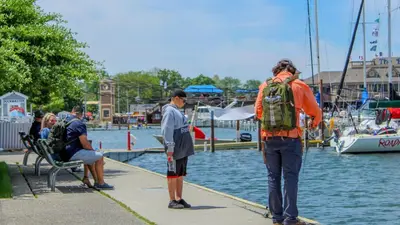 a group of people standing on a dock near the water at Put-in-Bay Island Club #108 in Put-in-Bay