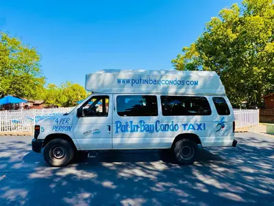 a white van parked in a parking lot at Put-in-Bay Island Club #83 in Put-in-Bay