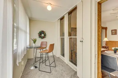 a small dining room with a table and chairs at Walk to Medina Square, Historic 1880 Home in Medina