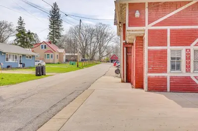 an empty street in a small town with houses at Walk to Medina Square, Historic 1880 Home in Medina
