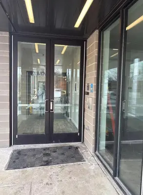 an entrance to a building with glass doors at Studio apartment with easy access to the city in Cleveland