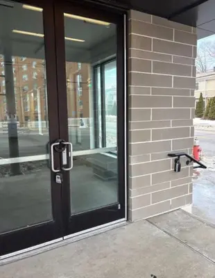 a glass door on a brick building with at Studio apartment with easy access to the city in Cleveland