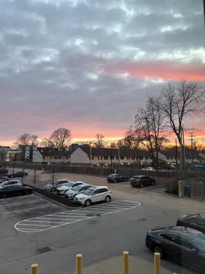 a parking lot with cars parked in a parking lot at Studio apartment with easy access to the city in Cleveland