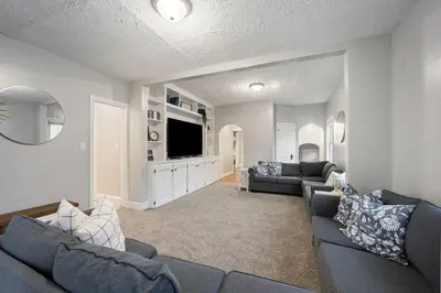 a living room with two couches and a tv at Newly Renovated Home <5 Mi to WEC! in Wilmington