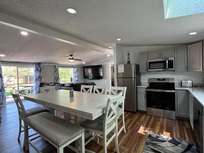 a kitchen and dining room with a table and chairs at Put-in-Bay Island Club #62 in Put-in-Bay