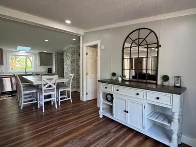 a kitchen and dining room with a table and a mirror at Put-in-Bay Island Club #62 in Put-in-Bay