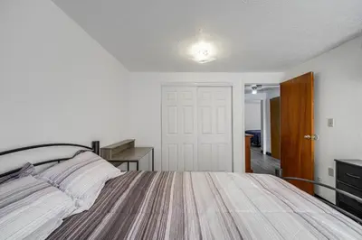 a bedroom with a bed and a desk in it at Red Line to Downtown! Inviting Home in Cleveland in Cleveland