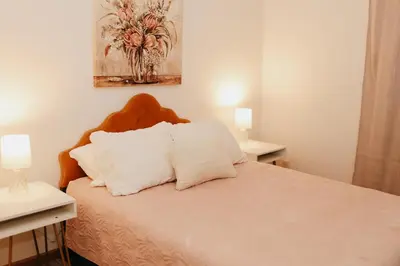 a bedroom with a bed with two white pillows at Cozy bungalow in the heart of historic Marysville in Marysville