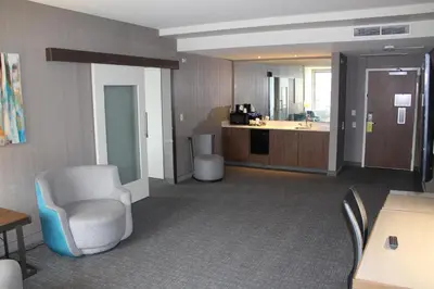 a large room with a waiting room and a kitchen at Courtyard by Marriott Muncie at Horizon Convention Center in Muncie