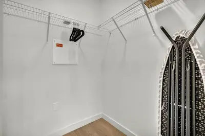 a dress hanging on a wall in a room at Little Italy & CWRU w King BedGymParkingWD in Cleveland