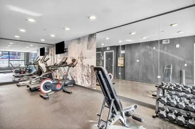 a gym with several treadmills and cardio machines at Little Italy & CWRU w King BedGymParkingWD in Cleveland
