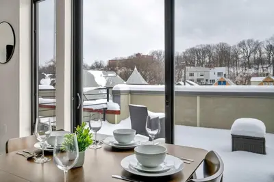 a dining table with a view of a balcony at Cleveland Clinic w KingBed Balcony Gym Parking WD in Cleveland