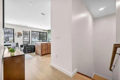 an open living room with a kitchen and a living room at Cleveland Clinic w KingBed Balcony Gym Parking WD in Cleveland