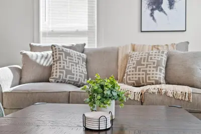 a living room with a couch and a coffee table at Creekside Stay | Peaceful Cottage | Elkhorn in Georgetown